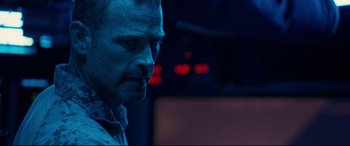 Movie still from “Captain Phillips” (2013), directed by Paul Greengrass – A person in a dark room; Close Up shot, Low angle