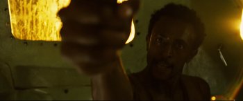 Movie still from “Captain Phillips” (2013), directed by Paul Greengrass – A person holding something in his hand; Close Up shot, Low angle