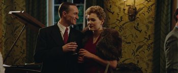 Movie still from “The Zookeeper's Wife” (2017), directed by Niki Caro – A man and a woman standing next to each other; Medium shot, Low angle