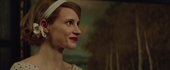 Movie still from “The Zookeeper's Wife” (2017), directed by Niki Caro – A person wearing a headband; Close Up shot, Over the shoulder angle