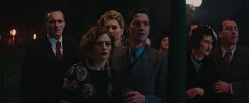 Movie still from “The Zookeeper's Wife” (2017), directed by Niki Caro – A man and a woman standing next to each other; Medium shot, Over the shoulder angle