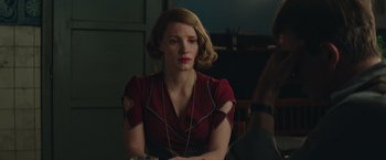 Movie still from “The Zookeeper's Wife” (2017), directed by Niki Caro – A woman sitting in front of a table; Close Up shot, Over the shoulder angle