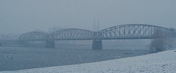 Movie still from “The Zookeeper's Wife” (2017), directed by Niki Caro – A large bridge in the middle of a snowy day; Extreme Wide shot, High angle