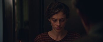 Movie still from “The Zookeeper's Wife” (2017), directed by Niki Caro – A person with her eyes closed; Close Up shot, Over the shoulder angle