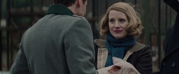 Movie still from “The Zookeeper's Wife” (2017), directed by Niki Caro – A woman wearing a blue scarf and a man wearing a green jacket; Close Up shot, Over the shoulder angle
