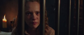 Movie still from “The Zookeeper's Wife” (2017), directed by Niki Caro – A woman with a sad look on her face; Close Up shot, High angle