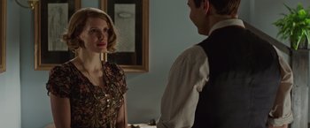 Movie still from “The Zookeeper's Wife” (2017), directed by Niki Caro – A man and a woman standing next to each other in front of a mirror; Medium shot, Over the shoulder angle