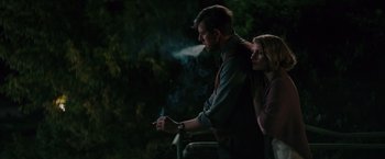 Movie still from “The Zookeeper's Wife” (2017), directed by Niki Caro – A man and a woman standing next to a railing; Medium shot, Low angle
