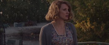 Movie still from “The Zookeeper's Wife” (2017), directed by Niki Caro – A woman standing in front of a tree; Close Up shot, Over the shoulder angle