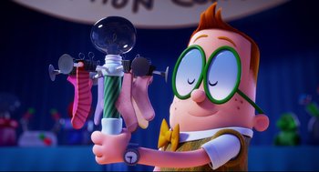 Movie still from “Captain Underpants: The First Epic Movie” (2017), directed by David Soren – A cartoon character is holding a pair of socks and a watch; Medium shot, Low angle