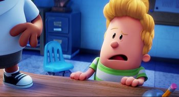 Movie still from “Captain Underpants: The First Epic Movie” (2017), directed by David Soren – A cartoon of a person sitting at a table; Close Up shot, Over the shoulder angle