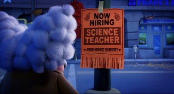 Movie still from “Captain Underpants: The First Epic Movie” (2017), directed by David Soren – An advertisement for a science teacher is posted on a lamp post; Wide shot, Over the shoulder angle