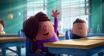 Movie still from “Captain Underpants: The First Epic Movie” (2017), directed by David Soren – A woman sitting at a table waving at someone; Medium shot, Over the shoulder angle