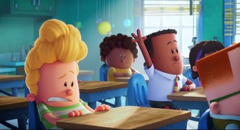 Movie still from “Captain Underpants: The First Epic Movie” (2017), directed by David Soren – A group of people sitting at a table in a classroom; Wide shot, Over the shoulder angle