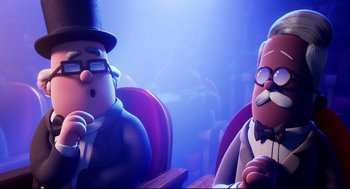 Movie still from “Captain Underpants: The First Epic Movie” (2017), directed by David Soren – Two cartoon characters sitting in a row of chairs; Medium shot, Over the shoulder angle