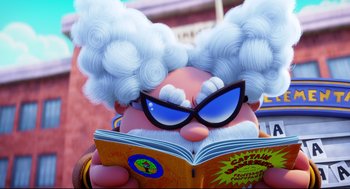 Movie still from “Captain Underpants: The First Epic Movie” (2017), directed by David Soren – An image of an animated character reading a book; Close Up shot, Low angle