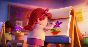 Movie still from “Captain Underpants: The First Epic Movie” (2017), directed by David Soren – A girl is painting a flower on a canvas; Medium shot, Over the shoulder angle