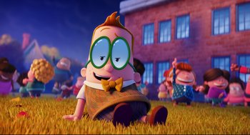 Movie still from “Captain Underpants: The First Epic Movie” (2017), directed by David Soren – A cartoon of a boy sitting in the grass; Wide shot, High angle