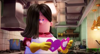 Movie still from “Captain Underpants: The First Epic Movie” (2017), directed by David Soren – A woman holding a heart shaped box in her hands; Close Up shot, Over the shoulder angle