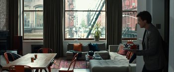Movie still from “This Is Where I Leave You” (2014), directed by Shawn Levy – A living room filled with furniture next to a large window; Wide shot, High angle