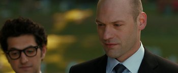 Movie still from “This Is Where I Leave You” (2014), directed by Shawn Levy – A man in a suit and tie looking down; Close Up shot, Over the shoulder angle