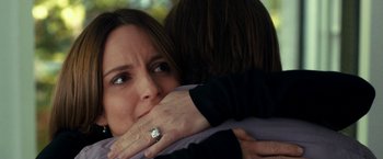 Movie still from “This Is Where I Leave You” (2014), directed by Shawn Levy – A woman hugging another woman with her hands over her face; Close Up shot, Over the shoulder angle