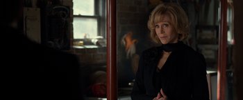 Movie still from “This Is Where I Leave You” (2014), directed by Shawn Levy – A woman standing in a room next to a fire place; Close Up shot, Over the shoulder angle