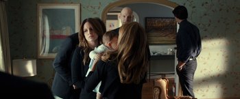 Movie still from “This Is Where I Leave You” (2014), directed by Shawn Levy – A group of people standing in front of a bathroom mirror; Medium shot, Over the shoulder angle