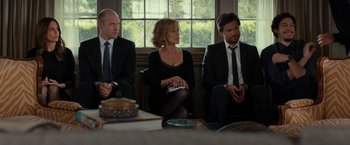 Movie still from “This Is Where I Leave You” (2014), directed by Shawn Levy – A group of people sitting around a table; Medium shot, Over the shoulder angle