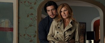 Movie still from “This Is Where I Leave You” (2014), directed by Shawn Levy – A man and a woman posing for a picture; Medium shot, Over the shoulder angle