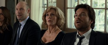 Movie still from “This Is Where I Leave You” (2014), directed by Shawn Levy – A person sitting in front of a window; Close Up shot, Over the shoulder angle