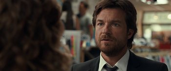 Movie still from “This Is Where I Leave You” (2014), directed by Shawn Levy – A person wearing a suit and tie; Close Up shot, Over the shoulder angle