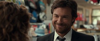 Movie still from “This Is Where I Leave You” (2014), directed by Shawn Levy – A person wearing a suit and tie; Close Up shot, Over the shoulder angle