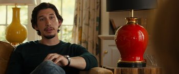 Movie still from “This Is Where I Leave You” (2014), directed by Shawn Levy – A man sitting on a couch next to a lamp; Close Up shot, Over the shoulder angle