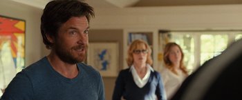 Movie still from “This Is Where I Leave You” (2014), directed by Shawn Levy – Two women and a man standing in a living room; Medium shot, Over the shoulder angle