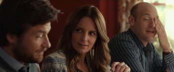 Movie still from “This Is Where I Leave You” (2014), directed by Shawn Levy – A person sitting at a table; Close Up shot, Over the shoulder angle