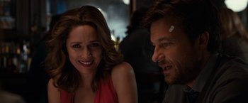 Movie still from “This Is Where I Leave You” (2014), directed by Shawn Levy – A man and a woman sitting next to each other at a table; Close Up shot, Over the shoulder angle