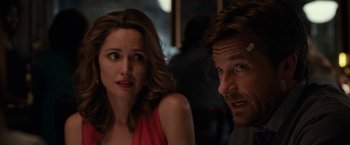 Movie still from “This Is Where I Leave You” (2014), directed by Shawn Levy – A man and a woman sitting next to each other in a room; Close Up shot, Over the shoulder angle