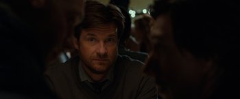 Movie still from “This Is Where I Leave You” (2014), directed by Shawn Levy – A person sitting in front of a group of people; Close Up shot, Over the shoulder angle