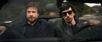 Movie still from “This Is Where I Leave You” (2014), directed by Shawn Levy – Two men sitting in the back seat of a car; Medium shot, Over the shoulder angle
