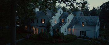 Movie still from “This Is Where I Leave You” (2014), directed by Shawn Levy – Two people are sitting on the porch of a house; Extreme Wide shot, High angle