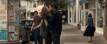 Movie still from “This Is Where I Leave You” (2014), directed by Shawn Levy – A man and a woman kissing on the sidewalk; Medium shot, Over the shoulder angle