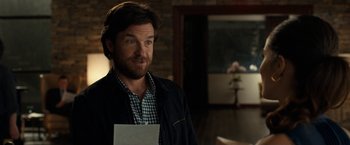 Movie still from “This Is Where I Leave You” (2014), directed by Shawn Levy – A person holding a piece of paper; Close Up shot, Over the shoulder angle