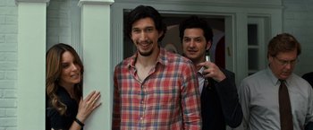 Movie still from “This Is Where I Leave You” (2014), directed by Shawn Levy – A man in a plaid shirt smiling for the camera; Medium shot, Over the shoulder angle