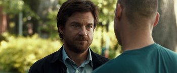 Movie still from “This Is Where I Leave You” (2014), directed by Shawn Levy – A man with a goatee is talking to another man; Close Up shot, Over the shoulder angle