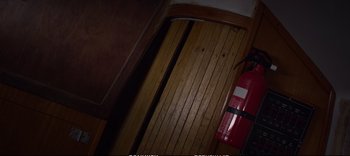 Movie still from “Cargo” (2017), directed by Gilles Coulier – A fire hydrant is next to a fire hydrant; Medium shot, Overhead angle