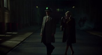 Movie still from “Carol” (2015), directed by Todd Haynes – A man and a woman walking down a street at night; Wide shot, Low angle