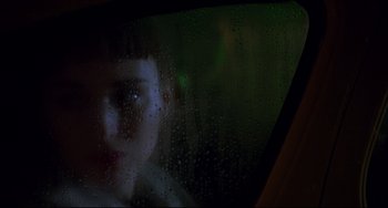 Movie still from “Carol” (2015), directed by Todd Haynes – A woman looking out of a car window at night; Close Up shot, Low angle