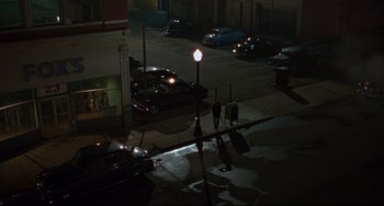 Movie still from “Carol” (2015), directed by Todd Haynes – Two people are walking down the street at night; Extreme Wide shot, High angle