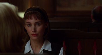 Movie still from “Carol” (2015), directed by Todd Haynes – A person sitting in a chair; Close Up shot, Over the shoulder angle